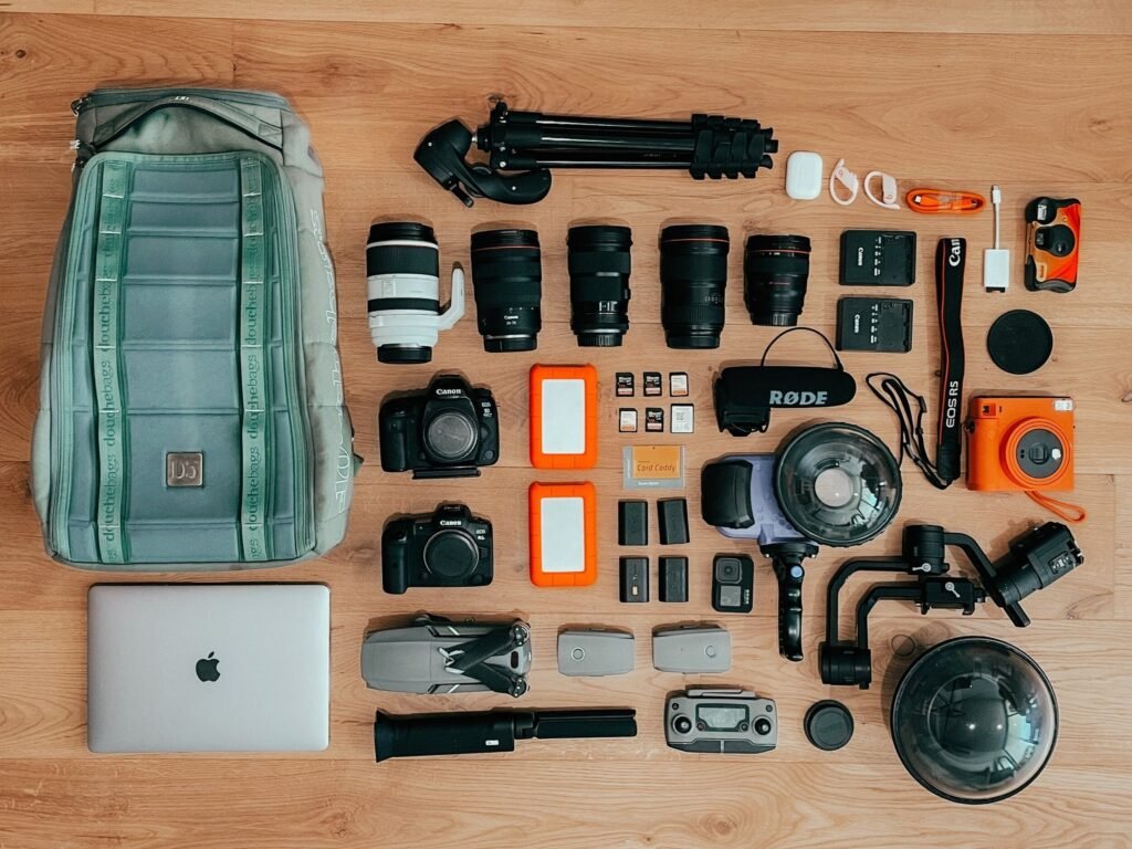 photography gear for travel, laptop, cameras, tripod, chargers, satchel
